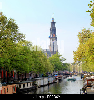 Springtime at Prinsengracht canal with the 17th century Westerkerk in  Amsterdam, the Netherlands in the background Stock Photo