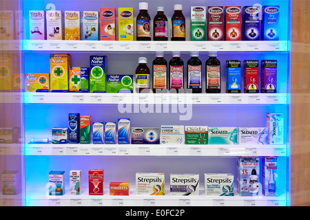Cold and Flu remedies and medicines in a Pharmacy or chemist's shop. Stock Photo