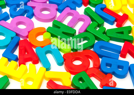 Magnetic letters on a white studio background. Stock Photo