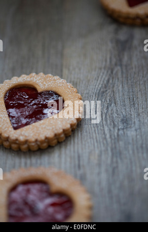 Strawberry Jam, heart shaped Linzer Biscuits on Wood Stock Photo