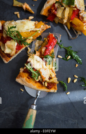 Homemade Vegetarian Pizza with Peppers, Brie & Rocket Stock Photo