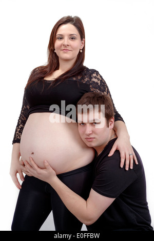 loving happy couple, smiling pregnant woman with her husband, isolated on white background Stock Photo