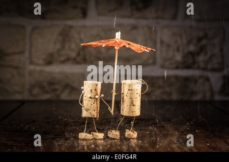 Concept Couple in the rain, wine cork figures Stock Photo