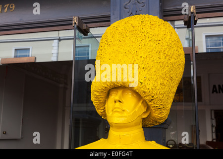 Yellow painted mannequin of guardsman Portobello Road London Stock Photo
