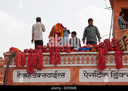 Merchants selling traditional headgear from a rooftop in the Tripolia bazaar Jaipur, India, where trading space is at a premium Stock Photo