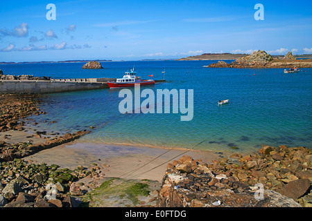 passengers getting ready to board Seahorse boat at St Agnes, Isles of Scilly, Scillies, Cornwall in April Stock Photo