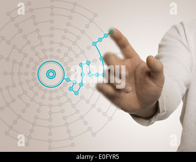 Finger pointing a network with blue and beige tones, concept of best solution or networking. Stock Photo