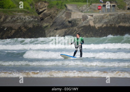 A female surfer in Newquay, Cornwall, England. Stock Photo