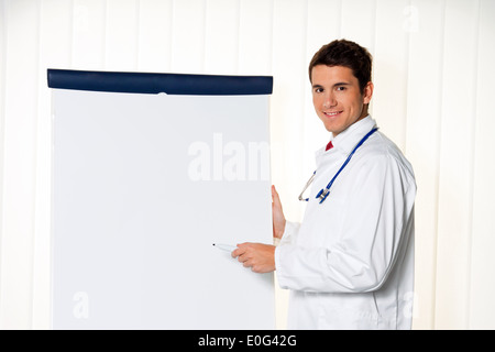 Successful businessman with flipchart by a presentation in meeting, Erfolgreicher Geschaeftsmann mit Flipchart bei einer Praesen Stock Photo