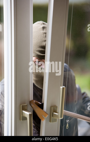 Burglar at a window housebreaker burglary