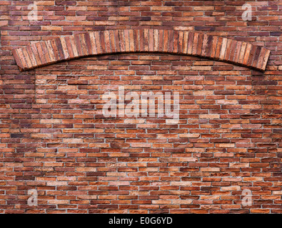 Texture of old red brick wall with an arch, grungy background Stock Photo