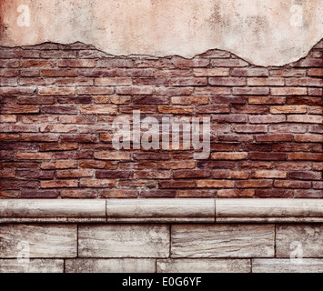 Old grungy brick wall with peeled off stucco rustic texture background Stock Photo