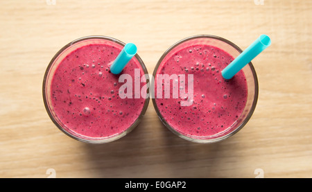 two raspberry smoothies in glasses Stock Photo