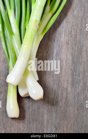 Young onion on wooden table Stock Photo - Alamy