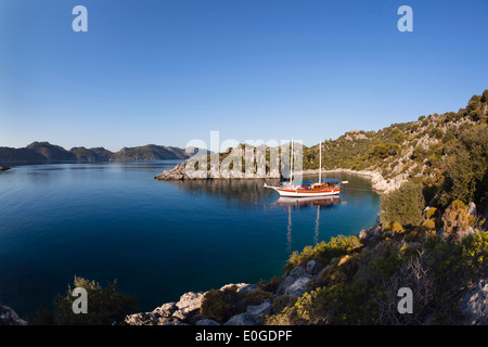 Sailing boat anchoring in pictoresque bay near Kekova and Simena, lycian coast, Lycia, Mediterranean Sea, Turkey, Asia Stock Photo