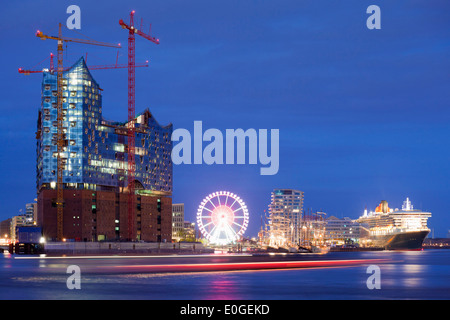 Elbphilharmonie and cruise ship Queen Mary 2 at harbour at night, Hamburg Cruise Center Hafen City, Hamburg, Germany, Europe Stock Photo