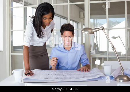 Architects working on blueprints Stock Photo