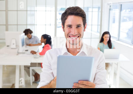 Businessman working on tablet pc Stock Photo