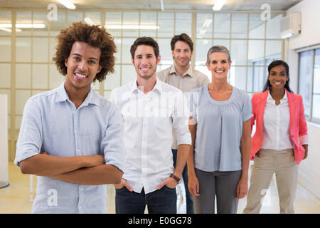 Group of workers smiling at the camera Stock Photo