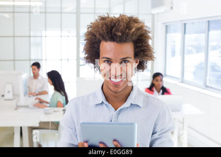 Casual worker using tablet pc Stock Photo