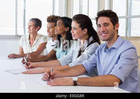 Group of workers listening to presentation Stock Photo