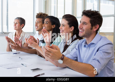 Business people clapping after presentation Stock Photo