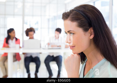Attractive businesswoman being thoughtful Stock Photo