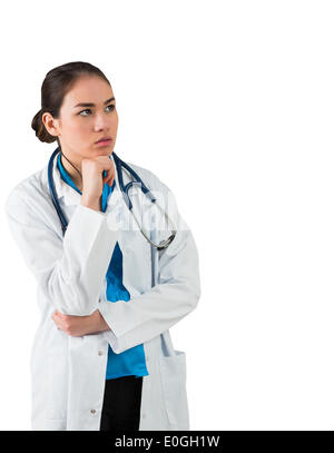 Serious doctor in lab coat thinking with hand on chin Stock Photo