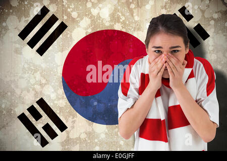 Nervous football fan looking ahead Stock Photo