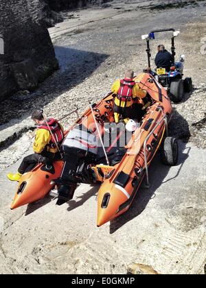 Port Isaac, Cornwall, UK. 13th May, 2014. The Port Isaac RNLI lifeboat launched about 1PM. They have been requested to assist the Coast Guard search for a missing person near Bossiney, Tintagel, Cornwall. Please note: Images taken with mbile phone. Credit:  nidpor/Alamy Live News Stock Photo