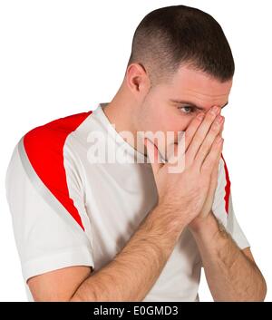 Disappointed football player looking down Stock Photo