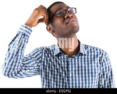 Young businessman thinking scratching head Stock Photo