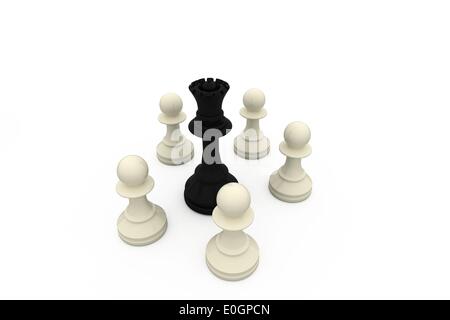 Black queen surrounded by white pawns Stock Photo