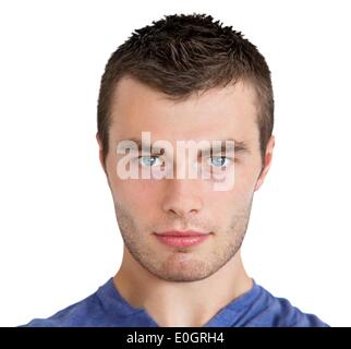 Serious young man looking at camera Stock Photo