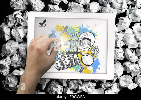 Composite image of hand touching tablet Stock Photo