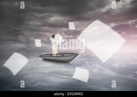 Composite image of thinking businesswoman in a boat Stock Photo