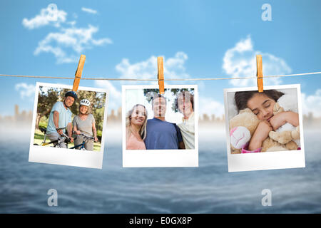Composite image of instant photos hanging on a line Stock Photo