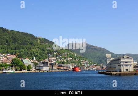 Offshore view across sea to buildings at entrance to Vågen harbour, Bergen, Hordaland, Norway, Scandinavia, Europe Stock Photo