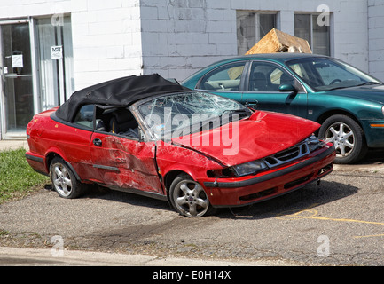 A smashed up Saab cabriolet that has been in an accident in Minneapolis, Minnesota, USA Stock Photo