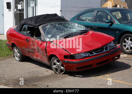 A smashed up Saab cabriolet that has been in an accident in Minneapolis, Minnesota, USA Stock Photo