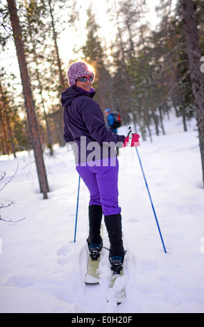 Young woman practicing Altai Skiing in Pyhä ski resort, Lapland, Finland Stock Photo