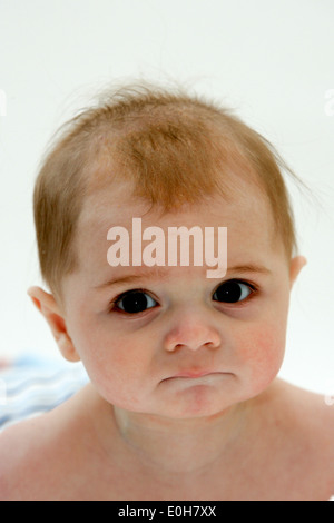 12 TWELVE MONTH OLD BABY BOY LEARNING TO CRAWL Stock Photo