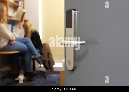 Two girls pose with door in focus Stock Photo