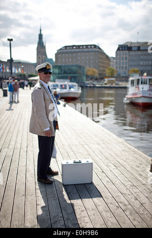 Captain at Alster Tourism pier, Inner Alster Lake, Hamburg, Germany Stock Photo