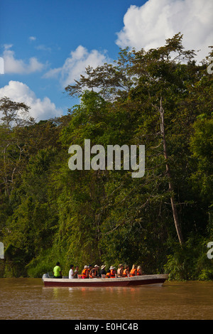 Tourists on safari in the KINABATANGAN RIVER WILDLIFE SANCTUARY which is home to many wildlife species - SABAH, BORNEO Stock Photo