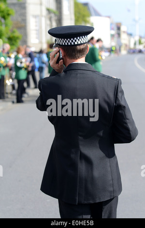 police inspector UK talking into radio Stock Photo - Alamy