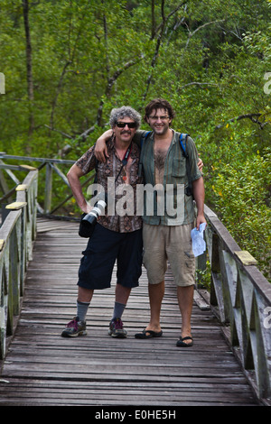 Bodhi Garrett and Craig Lovell on a walkway in BAKO NATIONAL PARK which is located in SARAWAK - BORNEO, MALASIA Stock Photo