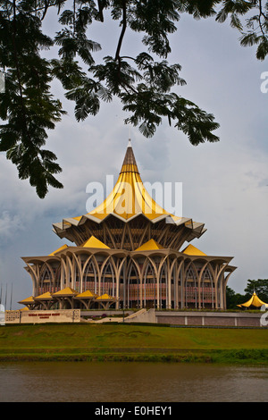 The SARAWAK STATE LEGISLATIVE ASSEMBLY or PARLIMENT BUILDING as seen from the KUCHING RIVER - KUCHING, SARAWAK, BORNEO, MALAYSIA Stock Photo