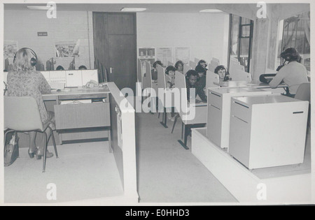 This photograph showcases a language laboratory at the Northern Ireland Higher Education (NIHE), emphasizing the educational technology and learning environment used for language acquisition during the 20th century. Stock Photo