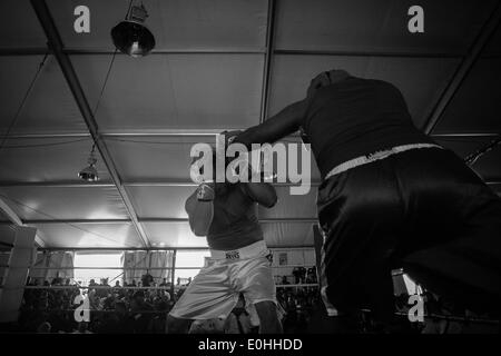 (140514) -- MEXICO CITY, May 14, 2014 (Xinhua) -- Federal policeman Francisco Javier Ruiz Garcia (L) and marine Luis Felipe 'El Choco' Garcia take part during the First Tournament of Boxing for Policemen which is organized by the World Boxing Council and the National Sports Commission (CONADE, for its acronym in Spanish) at the command center of Federal Police of Mexico, in Mexico City, capital of Mexico, on May 13, 2014. At least 160 members of the Federal Police, Secretary of National Defense (SEDENA, for its acronym in Spanish), Secretary of Marine (SEMAR, for its acronym in Spanish), and s Stock Photo